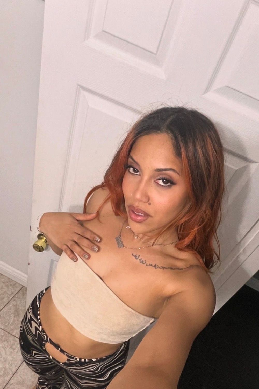 Post featuring Pretty Garbage Swirl Print Hip Cut Out Flare Pants - Brown