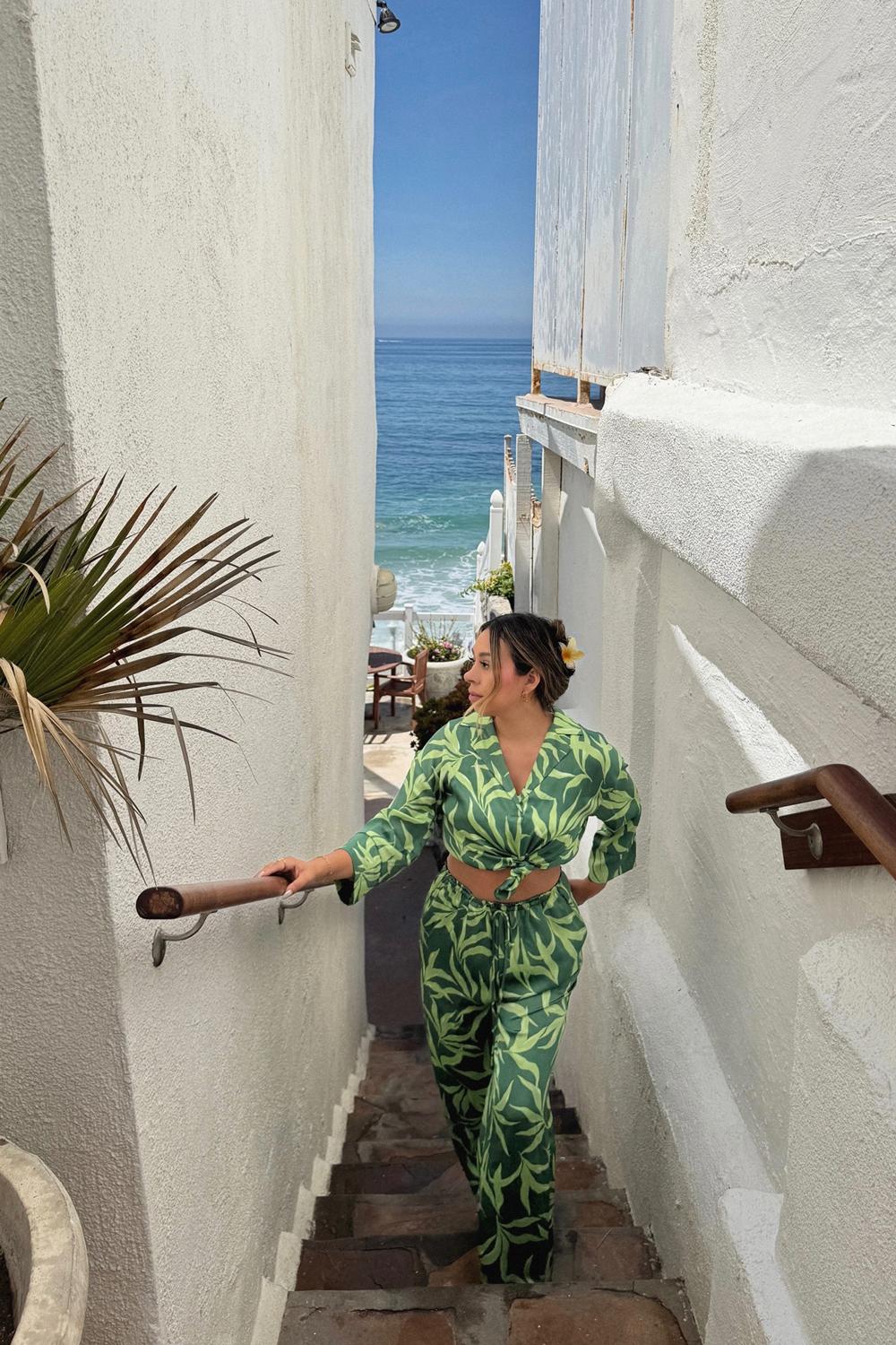 Post featuring Aurora 3/4 Sleeve Palm Print Collared Satin Button Down