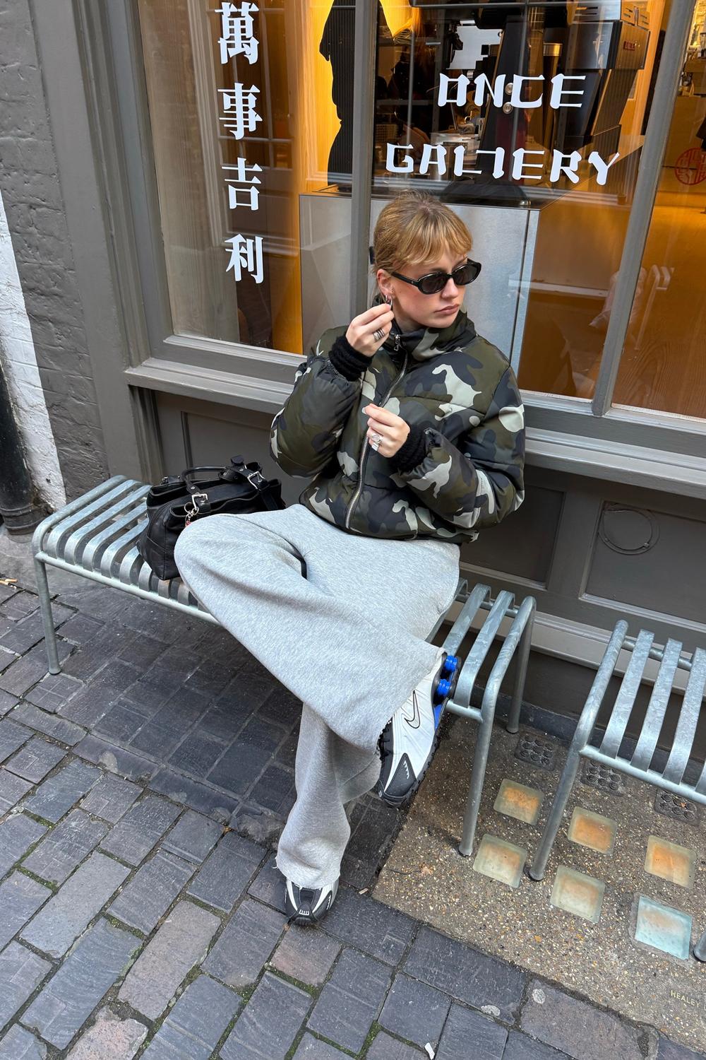 Post featuring Nike Shox R4 trainers in gold and black